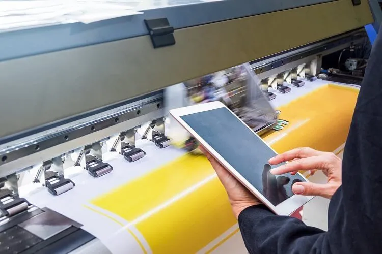 technician touch control tablet format inkjet printer during yellow vinyl 1